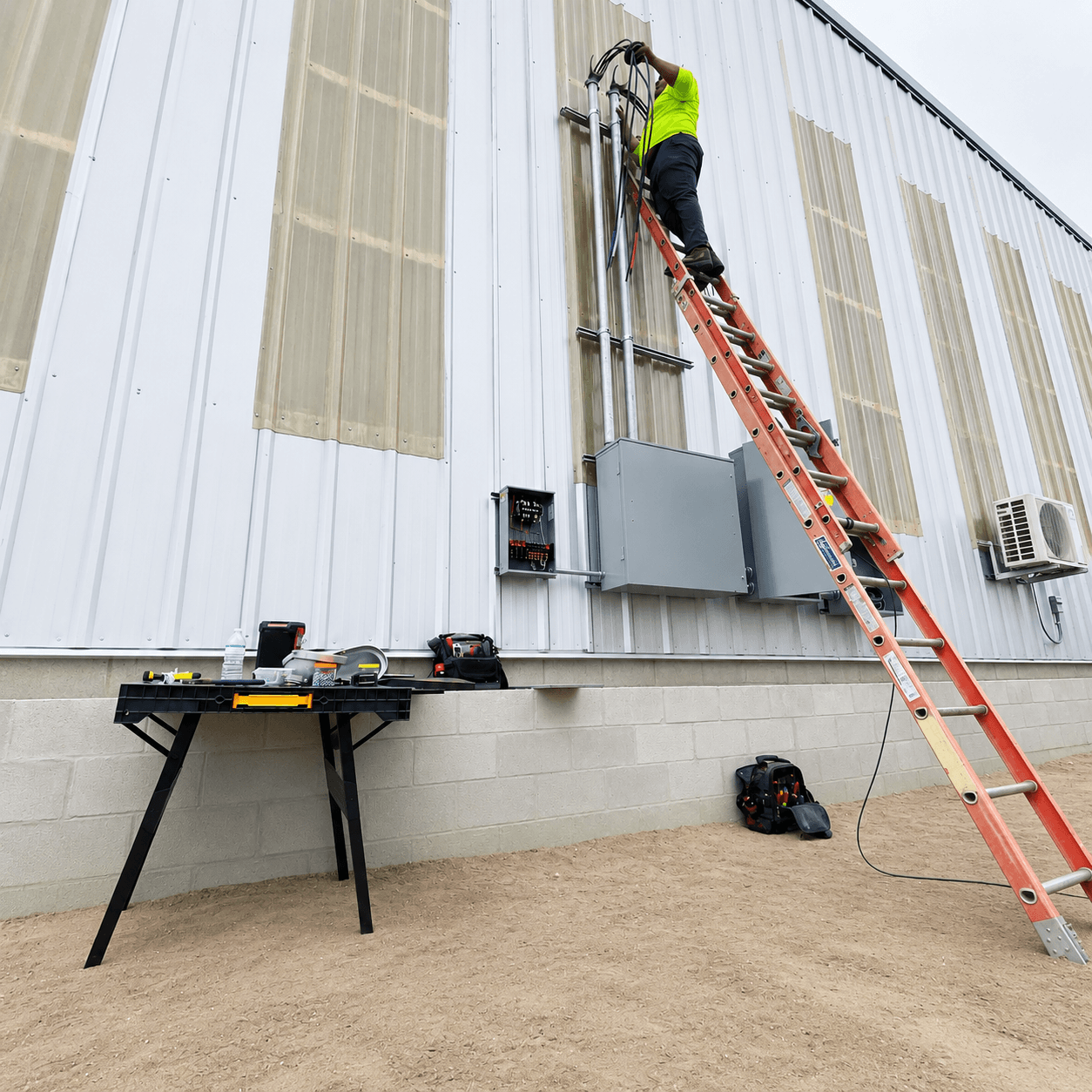 A licensed TrueBright Electric electrician installing a commercial electrical panel